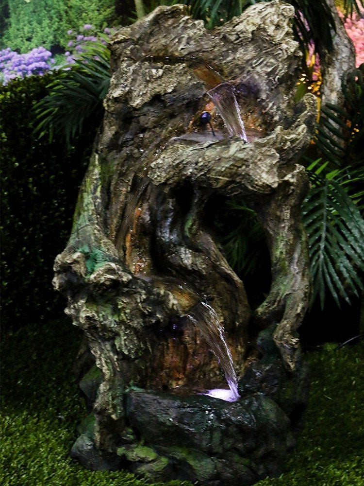 outdoor fountain tree trunk led